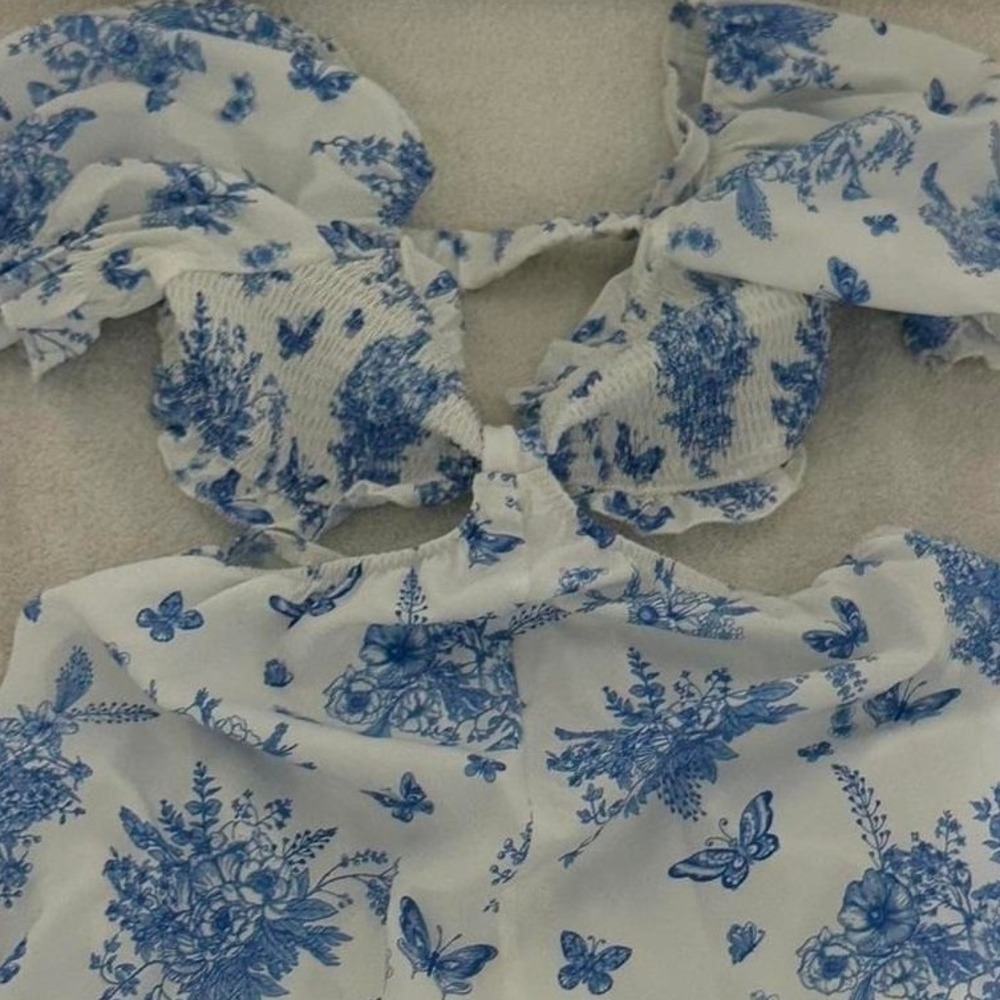 ASOS DESIGN cut out tie front romper in‎ blue floral print